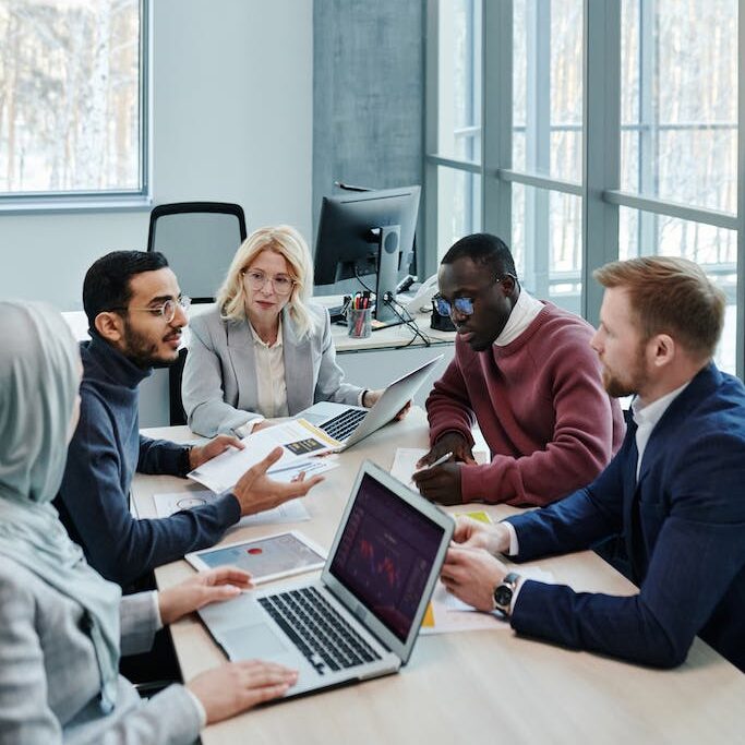 Office Team Sitting at the Table